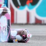 several-used-spray-cans-with-pink-and-white-paint-2023-11-27-05-23-47-utc